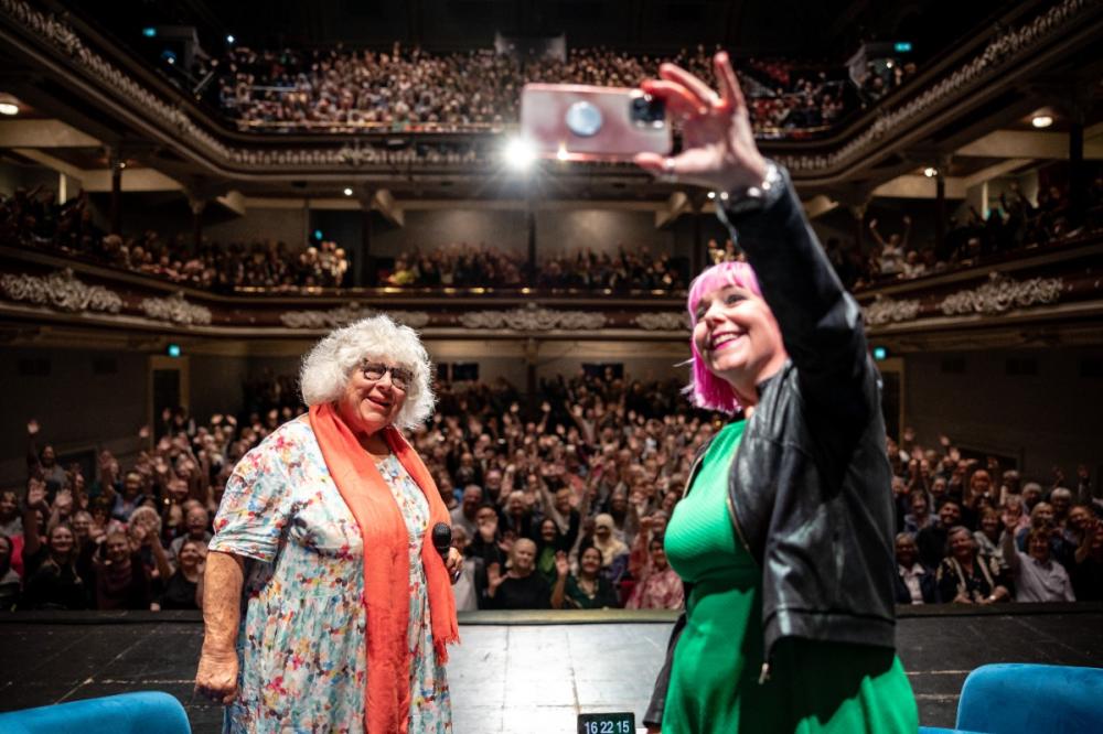 Miriam Margolyes and Peg Alexander take a selfie with the crowd at St George's Hall