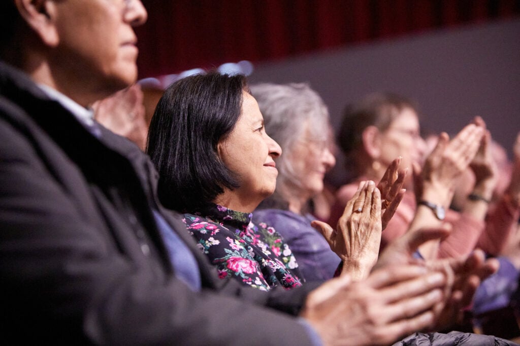 Audiences applaud at And Still We Rise